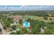 Aerial view showcasing the community's pool, sports fields, and surrounding green spaces at 2756 Summerfield Rd, Winter Park, FL 32792