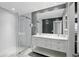 Elegant bathroom with a glass-enclosed shower, double vanity, and modern finishes at 2756 Summerfield Rd, Winter Park, FL 32792
