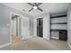 Neutral bedroom featuring modern shelving, closet, and ceiling fan at 2756 Summerfield Rd, Winter Park, FL 32792