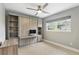 Neutral bedroom with built-ins, ceiling fan, and a bright window at 2756 Summerfield Rd, Winter Park, FL 32792