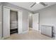 Bright bedroom with neutral carpet, ample storage, and modern ceiling fan at 2756 Summerfield Rd, Winter Park, FL 32792