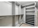 Organized closet space with custom shelving and hanging rods for optimal storage at 2756 Summerfield Rd, Winter Park, FL 32792