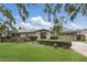 Charming single-story home featuring a landscaped lawn, brick accents, and a well-maintained yard at 2756 Summerfield Rd, Winter Park, FL 32792