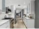 Spacious kitchen featuring modern stainless steel appliances, and white cabinetry at 2756 Summerfield Rd, Winter Park, FL 32792