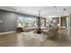 Open-concept living room showcases hardwood floors, neutral decor, and large windows offering ample natural light at 2756 Summerfield Rd, Winter Park, FL 32792