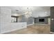 Inviting living area with hardwood floors, decorative lighting, and neutral walls creating a bright and airy space at 2756 Summerfield Rd, Winter Park, FL 32792
