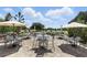 Outdoor patio seating area overlooking the golf course, perfect for relaxing and enjoying the views at 2756 Summerfield Rd, Winter Park, FL 32792