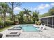 Backyard featuring a pool with spa, comfortable lounge chairs, and firepit at 2756 Summerfield Rd, Winter Park, FL 32792