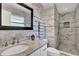 Updated bathroom features modern tiling, a sleek vanity, and a rainfall shower at 2859 T C U Blvd, Orlando, FL 32817
