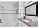 The bathroom offers updated fixtures, a granite vanity, and plenty of light at 2859 T C U Blvd, Orlando, FL 32817