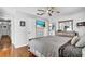 Well-lit bedroom boasts wood floors, a ceiling fan, and a comfortable layout at 2859 T C U Blvd, Orlando, FL 32817