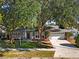 Charming home featuring mature trees, well-kept landscaping, and a two-car garage at 2859 T C U Blvd, Orlando, FL 32817