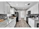 Bright kitchen with white cabinets, modern appliances, and attractive backsplash and flooring at 2859 T C U Blvd, Orlando, FL 32817