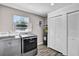 This laundry room has modern appliances and ample storage, with great natural light at 2859 T C U Blvd, Orlando, FL 32817