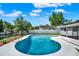 Backyard pool with updated pool deck, lush landscaping and canal view at 2859 T C U Blvd, Orlando, FL 32817