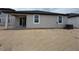 Exterior backyard elevation that is ready for landscaping and has two window views at 30155 Rustic Mill Street, Mount Dora, FL 32757