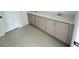 Bathroom featuring double sink vanity with neutral cabinets and tile floor at 30155 Rustic Mill Street, Mount Dora, FL 32757