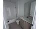 Well-lit bathroom featuring a tile backsplash, modern vanity, and updated fixtures at 30155 Rustic Mill Street, Mount Dora, FL 32757