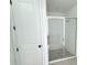 Modern bathroom showcasing sleek, glass-enclosed shower with chrome hardware and tiled walls at 30155 Rustic Mill Street, Mount Dora, FL 32757