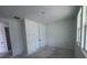 Bedroom featuring a double-door closet for ample storage and a bright window at 30155 Rustic Mill Street, Mount Dora, FL 32757
