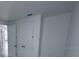 Hallway featuring double-door closet for ample storage at 30155 Rustic Mill Street, Mount Dora, FL 32757