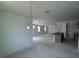Bright living area features a stylish kitchen island, sleek fixtures, and contemporary design at 30155 Rustic Mill Street, Mount Dora, FL 32757