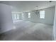 Spacious living room bathed in natural light and featuring sleek design at 30155 Rustic Mill Street, Mount Dora, FL 32757