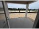 Covered patio with a view of the backyard that is perfect for outdoor entertaining at 30155 Rustic Mill Street, Mount Dora, FL 32757