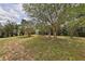 Spacious backyard features lush landscaping and a storage shed at 309 Panama Cir, Winter Springs, FL 32708