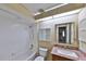 Bright bathroom offers a shower-tub combo, a granite vanity, and a mirrored medicine cabinet at 309 Panama Cir, Winter Springs, FL 32708