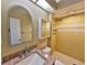 Bright bathroom featuring a granite countertop vanity and a tiled shower for a clean, fresh feel at 309 Panama Cir, Winter Springs, FL 32708