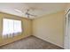 Bedroom features neutral walls, a ceiling fan, carpet floors, and a built-in window desk at 309 Panama Cir, Winter Springs, FL 32708