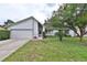 Charming single Gathering home featuring a well-manicured lawn and attached garage in a desirable neighborhood at 309 Panama Cir, Winter Springs, FL 32708
