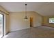 Bright living room features neutral carpet, and a modern chandelier at 309 Panama Cir, Winter Springs, FL 32708
