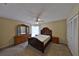 Comfortable bedroom with neutral carpeting and a ceiling fan, creating a relaxing atmosphere at 309 Panama Cir, Winter Springs, FL 32708