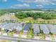 Aerial view of a delightful single-Gathering home nestled among other residences and mature trees at 3149 Songbird Cir, Harmony, FL 34773