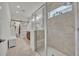 Bright bathroom featuring glass shower and access to walk-in closet at 3149 Songbird Cir, Harmony, FL 34773