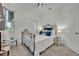 Cozy bedroom with a wrought iron bed frame, plush carpet, and natural light from the window at 3149 Songbird Cir, Harmony, FL 34773