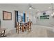 Dining room with wood table and chairs, bright natural light, tile flooring, and neutral paint at 3149 Songbird Cir, Harmony, FL 34773