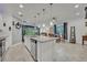 Spacious kitchen with stainless steel appliances, large island, recessed lighting, and open floor plan at 3149 Songbird Cir, Harmony, FL 34773