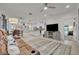Open concept living room with a ceiling fan, and an island kitchen at 3149 Songbird Cir, Harmony, FL 34773