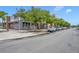 Storefront with vibrant windows, sidewalk, street, mature trees and parallel parking adds to the neighborhood's appeal at 3149 Songbird Cir, Harmony, FL 34773