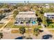 Aerial view of townhouses with fenced patios, lush lawns, and mature trees in a charming neighborhood at 315 Glenview Blvd # 3, Daytona Beach, FL 32118