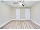 This bedroom features wood floors, two closets, base trim, and is freshly painted at 315 Glenview Blvd # 3, Daytona Beach, FL 32118