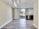 Open dining area featuring modern light fixtures, sliding glass doors, and adjacent kitchen with stainless steel appliances at 315 Glenview Blvd # 3, Daytona Beach, FL 32118
