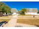 Inviting townhouse exteriors with well-kept lawns and attractive brick accents under a clear blue sky at 315 Glenview Blvd # 3, Daytona Beach, FL 32118