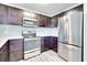 Modern kitchen featuring stainless steel appliances, dark cabinets, tiled backsplash, and stainless steel refrigerator and oven at 315 Glenview Blvd # 3, Daytona Beach, FL 32118