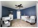 Charming Bedroom with blue accent wall, ceiling fan and Winnie the Pooh accents at 318 Briarbrook Ln, Haines City, FL 33844