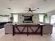 Comfortable living room featuring neutral paint, ceiling fan, tiled floors, and an open-concept layout at 318 Briarbrook Ln, Haines City, FL 33844
