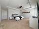 Large main bedroom featuring a tray ceiling, ceiling fan, and neutral carpeting at 318 Briarbrook Ln, Haines City, FL 33844